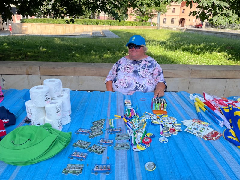 A vendor in Warsaw displays flags and magnets in support of Ukraine and its President Volodymyr Zelenskyy.  Ramola Talwar Badam/The National