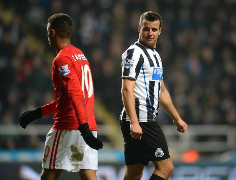 NEWCASTLE UPON TYNE ENGLAND, JANUARY 4: Steven Taylor (R) of Newcastle United and Fraizer Campbell of Cardiff City exchange words during the Budweiser FA Cup Third Round match between Newcastle United and Cardiff City at St James Park on January 4, 2014 in Newcastle Upon Tyne, England. (Photo by Mark Runnacles/Getty Images)