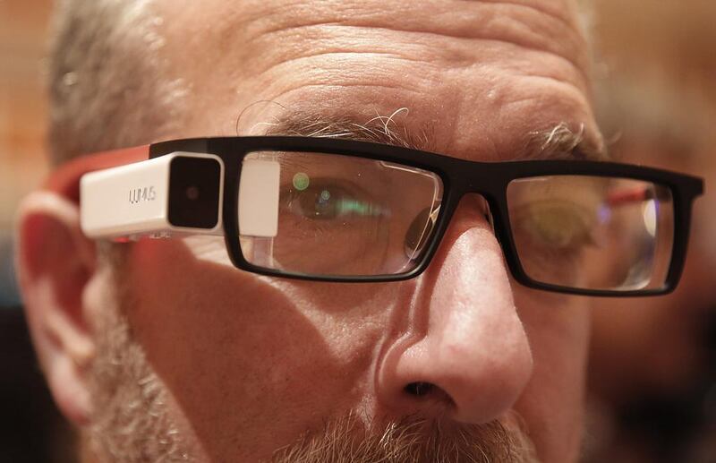 Steve Leon, partner of ShowStoppers, wears a pair of DK40 smartglasses during the ShowStoppers exhibition. Patrick T Fallon / Bloomberg