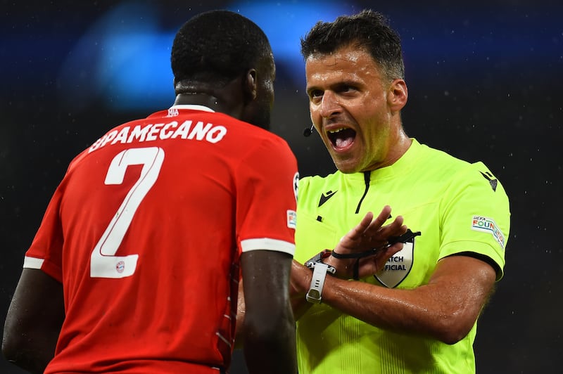 Dayot Upamecano of Bayern Munich argues with referee Jesus Gil Manzano. EPA