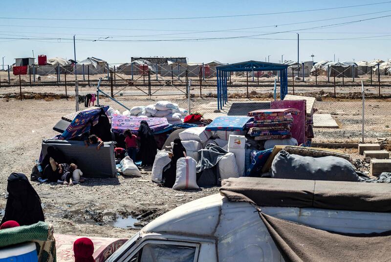 Families at Al Hol gather their belongings as they prepare to return home to Syria's northern Raqqa region. AFP