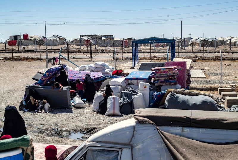 Families at Al Hol gather their belongings as they prepare to return home to Syria's northern Raqqa region. AFP