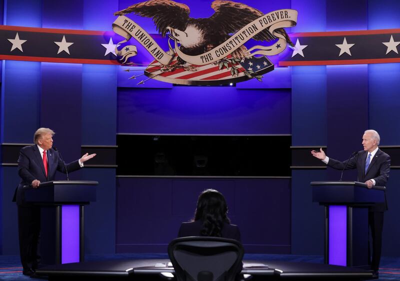 US President Donald Trump (L), Democratic Presidential candidate former US Vice President Joe Biden and moderator, NBC News anchor, Kristen Welker (C) participate in the final presidential debate at Belmont University in Nashville, Tennessee, on October 22, 2020. (Photo by Chip Somodevilla / POOL / AFP)