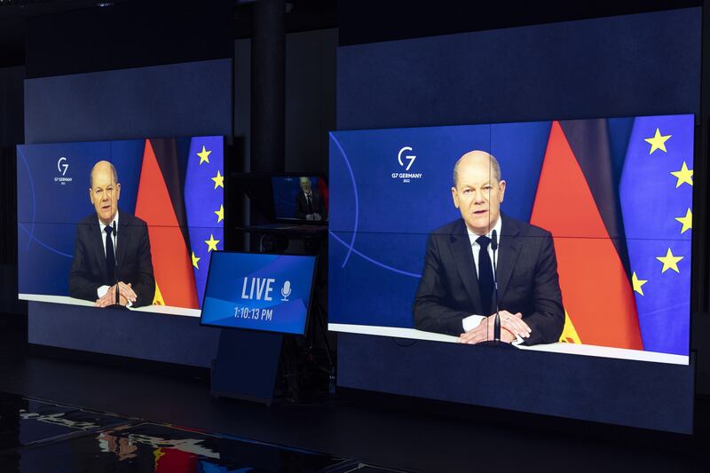 German Chancellor Olaf Scholz on screens addressing his statement during the Davos Agenda 2022, in Cologny near Geneva, Switzerland, 19 January 2022.  The Davos Agenda, held from 17 to 21 January 2022, is an online edition due to the coronavirus disease (COVID-19) outbreak, and gathers global leaders to shape the principles, policies and partnerships needed in this challenging context.   EPA / SALVATORE DI NOLFI