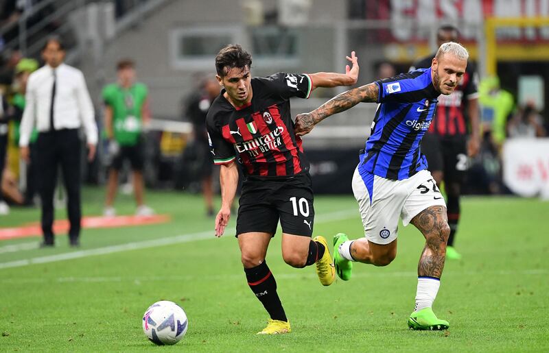 AC Milan midfielder Brahim Diaz fights for the ball with Inter Milan defender Federico Dimarco. AFP