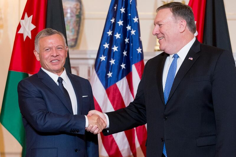 epa06831498 US Secretary of State Mike Pompeo (R) and King Abdullah II of Jordan shake hands during a photo opportunity for members of the news media before their working luncheon at the State Department in Washington, DC, USA, 22 June 2018.  EPA/MICHAEL REYNOLDS