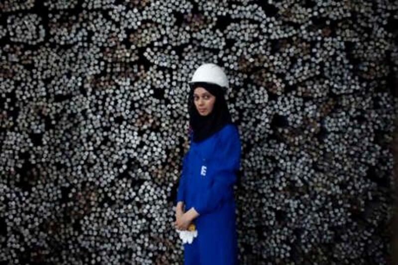 Abu Dhabi - June 9, 2010: Mariam al Hammadi, the Þrst Emirati female chemical engineer to work at a steel plant, at Emirates Steel. Lauren Lancaster / The National