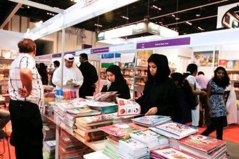 Attendees browse books at this year's Abu Dhabi International Book Fair at the Abu Dhabi National Exhibition Centre.