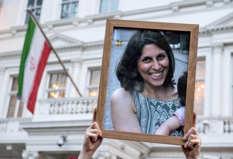 Supporters hold a photo of Nazanin Zaghari-Ratcliffe during a vigil for the British-Iranian mother, who was jailed in September 2016 for allegedly attempting to overthrow the Iranian government.  Chris J Ratcliffe/Getty Images