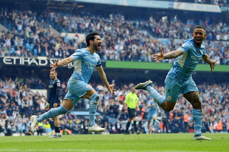 Ilkay Gundogan celebrates with Gabriel Jesus after scoring Manchester City's third goal against Aston Villa. Getty