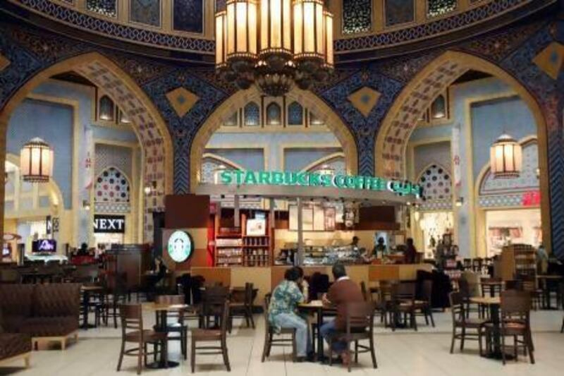 The classic Arabian decor in the Ibn Battuta Mall in Dubai contrasts with the many shop fronts and advertising slogans in English. Some experts blame globalisation for a decline in Arabic. Randi Sokoloff / The National