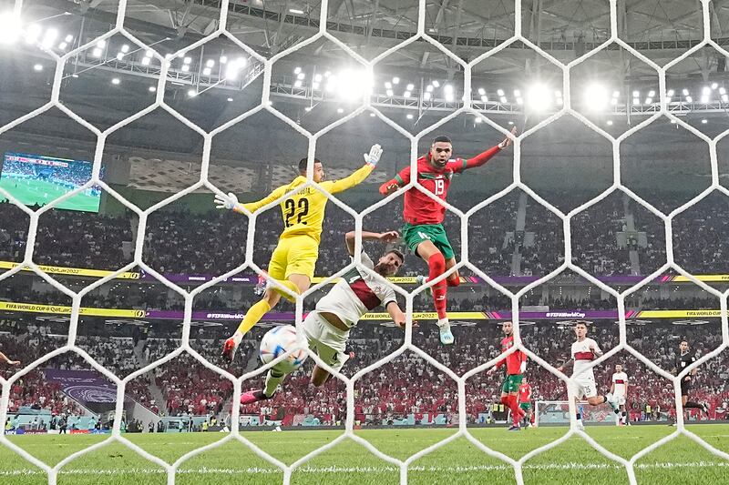 Morocco's Youssef En-Nesyri heads home in the first half. AP