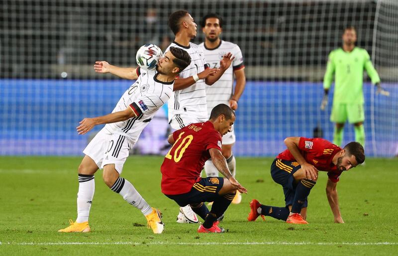Germany's Suat Serdar controls the ball in front of in action with Spain's Thiago Alcantara. Reuters