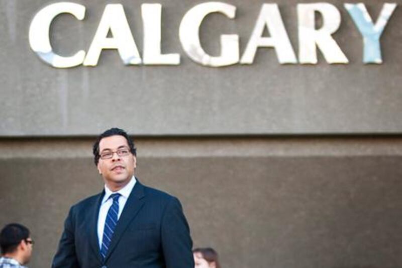 Naheed Nenshi walks outside Calgary city hall on Tuesday, one day after being elected to the mayoralty at age 38.