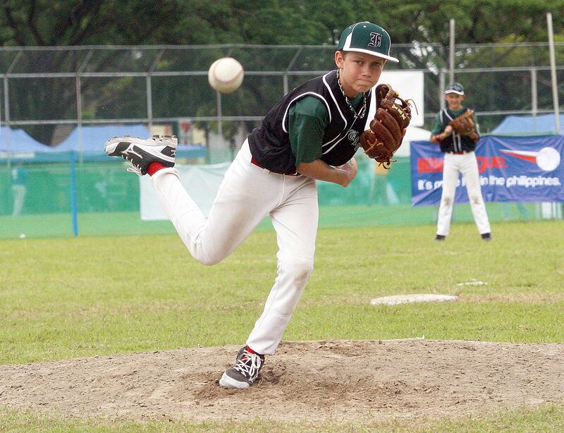 Clarke Philippines, July 02 2013, Asian Pacific Little League Playoffs, Paul radley Story- UAE All-Star Sam page delivers a pitch as the UAE and Singapore match up in the Asian Pacific Little League Playoffs in Clarke Philippines. The UAE fell to Team Singapore 8-5  . Mike Young For The National