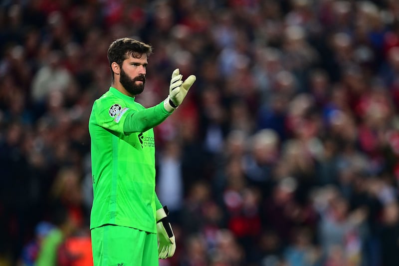 LIVERPOOL PLAYER RATINGS: Alisson Becker - 6. There will be few games when the Brazilian has so little to do and yet concede twice. He could not have stopped either goal. AFP