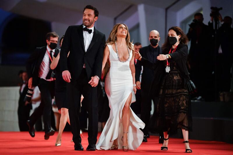 Affleck and Lopez seem to take joy in walking the red carpet as a reunited couple. AFP