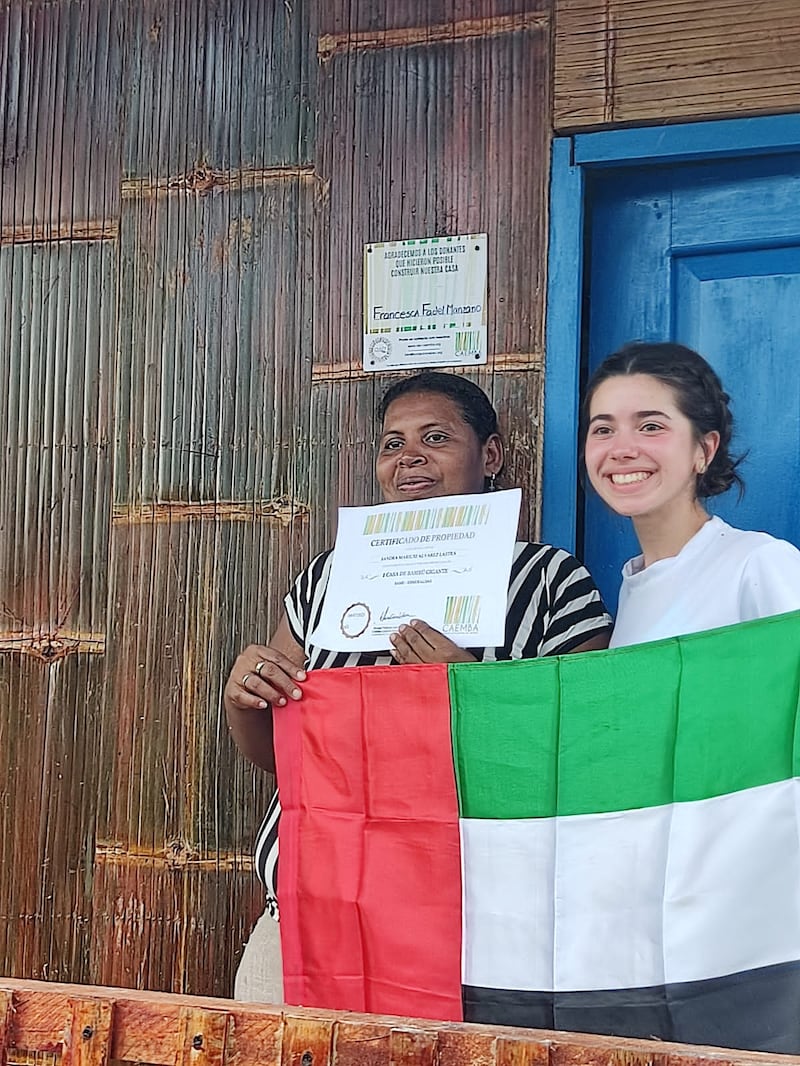 Francesca Fadel pictured at the home she helped to build for a vulnerable family in Ecuador. All photos: CAEMBA