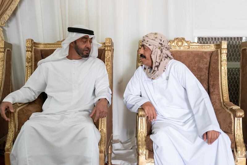 FUJAIRAH, UNITED ARAB EMIRATES - September 16, 2019: HH Sheikh Mohamed bin Zayed Al Nahyan, Crown Prince of Abu Dhabi and Deputy Supreme Commander of the UAE Armed Forces (L) offers condolences to the family of martyr Warrant Officer Saif Dhawi Rashid Al Tunaiji.

( Mohamed Al Hammadi / Ministry of Presidential Affairs )
---