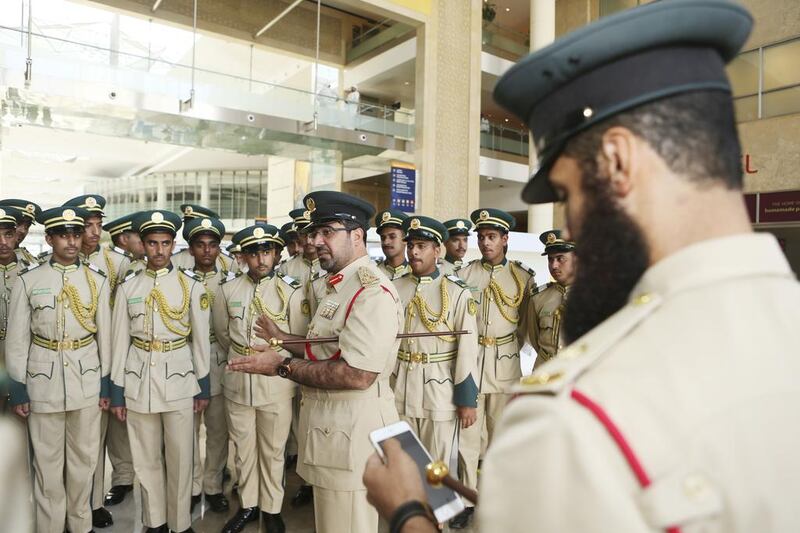 Brig Ghaith Al Suwaidi, Director of Dubai Police Academy, speaks to cadets after they cast their ballots on the last day of early voting at polling stations in Dubai on Wednesday. Sarah Dea / The National 