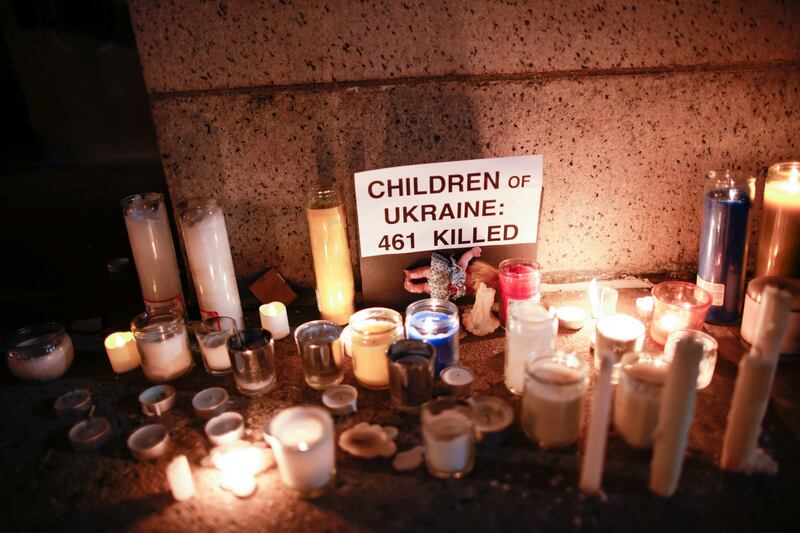 Candles lit outside the Russian consulate in New York during a vigil to commemorate children killed in Ukraine. AFP