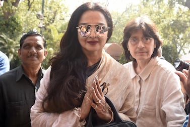 A security guard for actress Rekha, centre, pictured in 2017, has tested positive for Covid-19. Getty Images