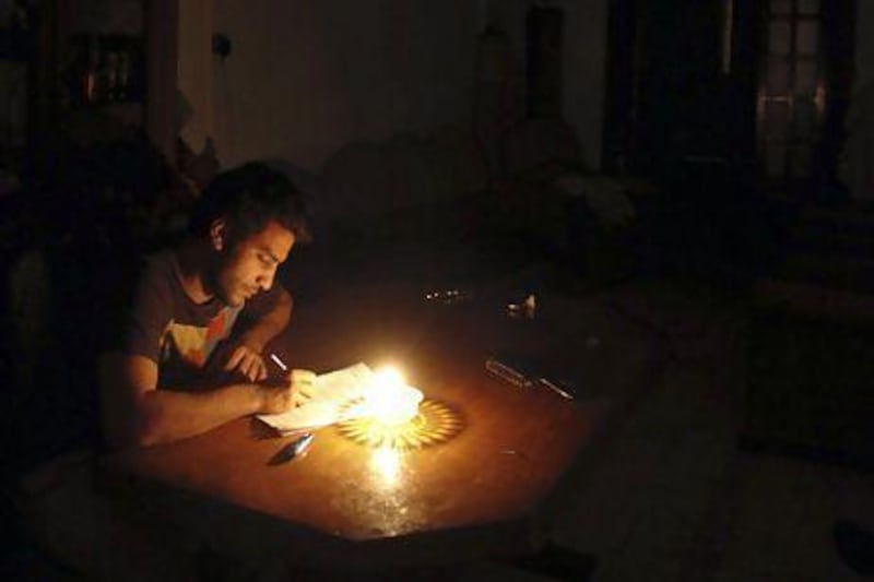 An Egyptian student studies by candlelight. The North African country has been hit by persistent power cuts. Amr Abdallah Dalsh / Reuters