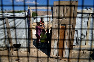 Syrian children at a refugee camp in the town of Bar Elias, in Lebanon's Bekaa Valley, in June. AP Photo