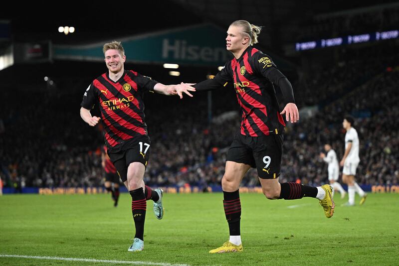 Erling Haaland celebrates scoring City's second goal with Kevin De Bruyne. AFP