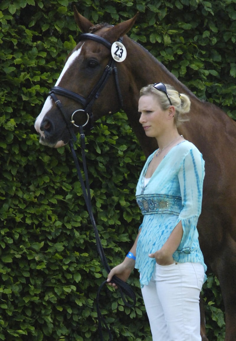 Zara Phillips, wearing a turquoise top and white trousers, leads her horse to a veterinary inspection before qualifying for competition at Bramham Park International Horse Trials on June 7, 2006 in Yorkshire. Andrew Stuart