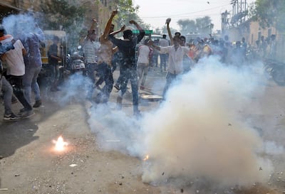 Fans of Bollywood star Salman Khan burst crackers outside a jail where the actor is lodged in Jodhpur, Rajasthan state, India, Saturday, April 7, 2018.  A court on Saturday granted bail to Khan, who is appealing his conviction on charges of poaching rare deer in a wildlife preserve two decades ago. Khan was sentenced Thursday to five years in prison on the charges and was immediately sent to jail. Judge Ravindra Kumar Joshi ordered him to sign a surety bond of 50,000 rupees ($770) on Saturday before he could be set free in Jodhpur, a town in western India. (AP Photo/Sunil Verma)