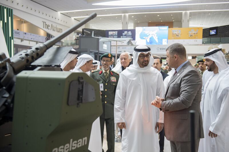 Sheikh Mohammed bin Zayed Crown Prince of Abu Dhabi and Deputy Supreme Commander of the Armed Forces tours the International Golden Group Integrated Systems exhibit with Lt General Hamad Thani Al Romaithi, Chief of Staff UAE Armed Forces, centre. Rashed Al Mansoori / Crown Prince Court - Abu Dhabi