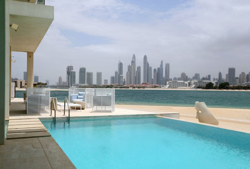 The Palm Jumeirah property swimming pools offerings Dubai skyline views