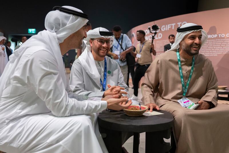 From left, Sheikh Hamdan bin Mohamed; Ahmed Al Mazrouei, chairman of the Abu Dhabi Executive Office and the Strategic Affairs Council; and Sheikh Mohamed bin Hamad, Special Affairs Adviser at the Presidential Court, visit the Ethiopian Pavilion at Cop28. Photo: UAE Presidential Court 