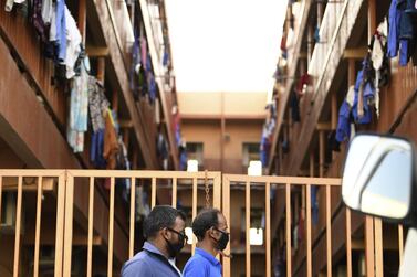 Foreign workers wearing protective masks amid the Covid-19 pandemic in Dubai. AFP