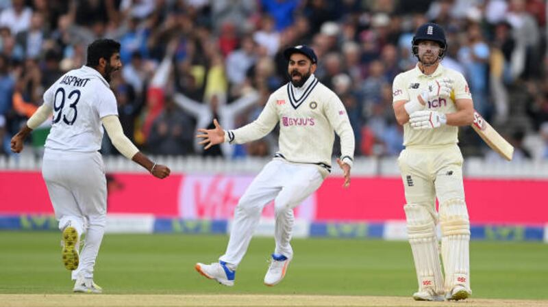 Jasprit Bumrah and Virat Kohli celebrate the wicket of Rory Burns of England during the 2021 Lord's Test. Getty
