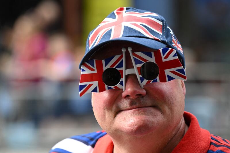 A royal fan dons Union Jack glasses for the big day. AFP