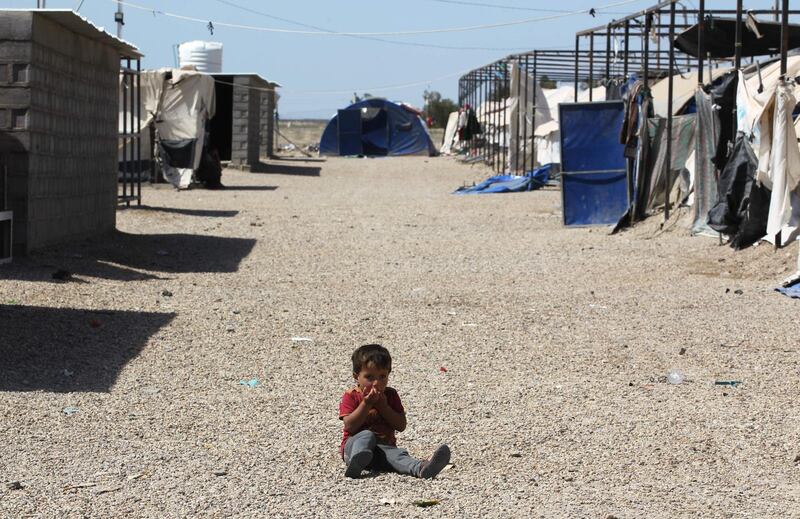 A displaced Iraqi child sits in a camp for internally displaced people near al-Khalidiyeh in Iraq's western Anbar province. While the election campaign is in full swing elsewhere in Iraq, the country's displaced camps barely register on the radars of those running for office, despite housing hundreds of thousands of people. Ahmad Al Rubaye / AFP