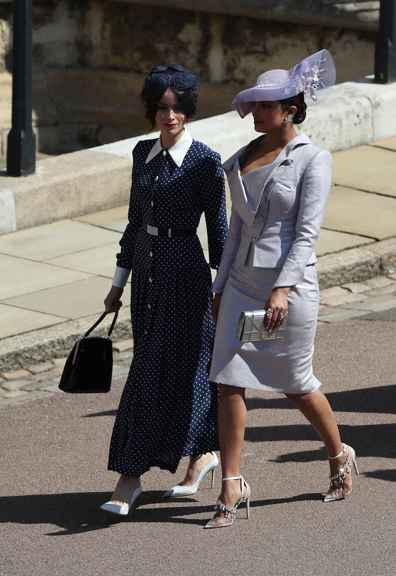 WINDSOR, UNITED KINGDOM - MAY 19:  Suits actress Abigail Leigh Spencer and Bollywood actress Priyanka Chopra (right) arrive for the wedding ceremony of Britain's Prince Harry and US actress Meghan Markle at St George's Chapel, Windsor Castle on May 19, 2018 in Windsor, England. (Photo by Andrew Milligan - WPA Pool/Getty Images)
