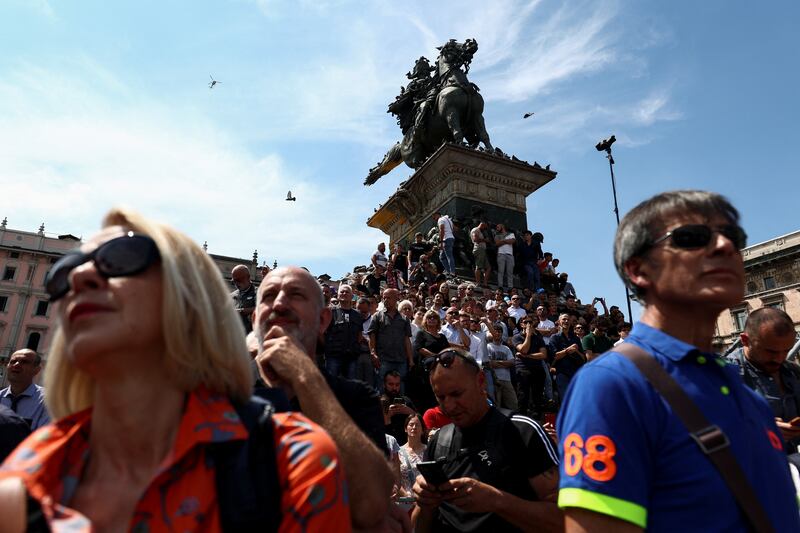 People watch the funeral in Milan. Reuters