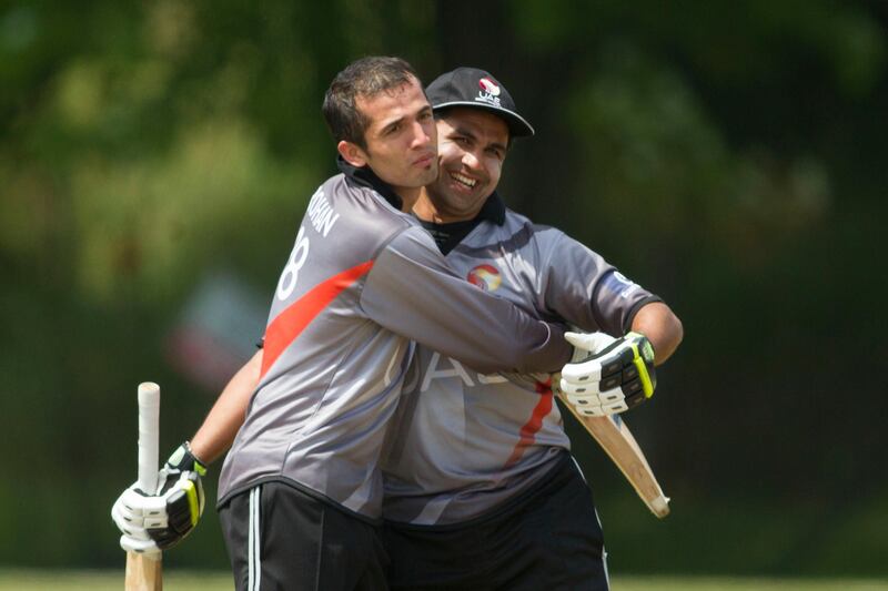 KING CITY, CANADA : August 6, 2013 UAE batman Shaiman Anwar (right) is congratulated by Rohan Mustafa  as he reaches his century on the final ball of the innings against   Canada during the one day international  at the Maple Leaf Cricket club in King City, Ontario, Canada ( Chris Young/ The National). For Sports *** Local Caption ***  chy202.jpg