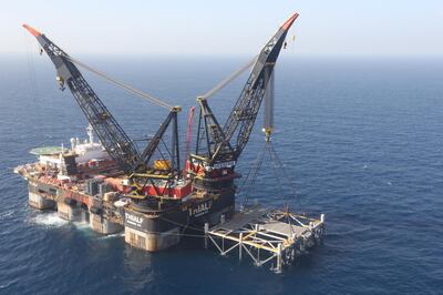 epa08716985 (FILE) - An aerial view of SSCV Thialf, the largest crane vessel in the world, at the Leviathan gas platform of Noble Energy at the Mediterranean Sea, some 10 km from the Israeli coast, 31 January 2019, after the foundations of a 98-meter-tall and 15,500-ton-weighing metal structure (R) were lowered onto the sea bed from aboard a large barge late 30 January 2019 (reissued 03 October 2020). Media reports on 03 October 2020 state shareholders of Houston-based Noble Energy on 02 October 2020 agreed to a takeover deal of Chevron Corp., of purchasing Nobel Energy in an all-stock agreement valued at some 4.1 billion USD.  EPA/MARC ISRAEL SELLEM / POOL *** Local Caption *** 55103860