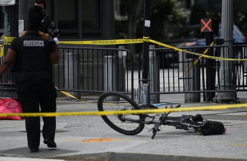 A US Secret Service uniform officer's bike is seen laying on the sidewalk on Pennsylvania Aavenue near the White House in Washington.  AFP