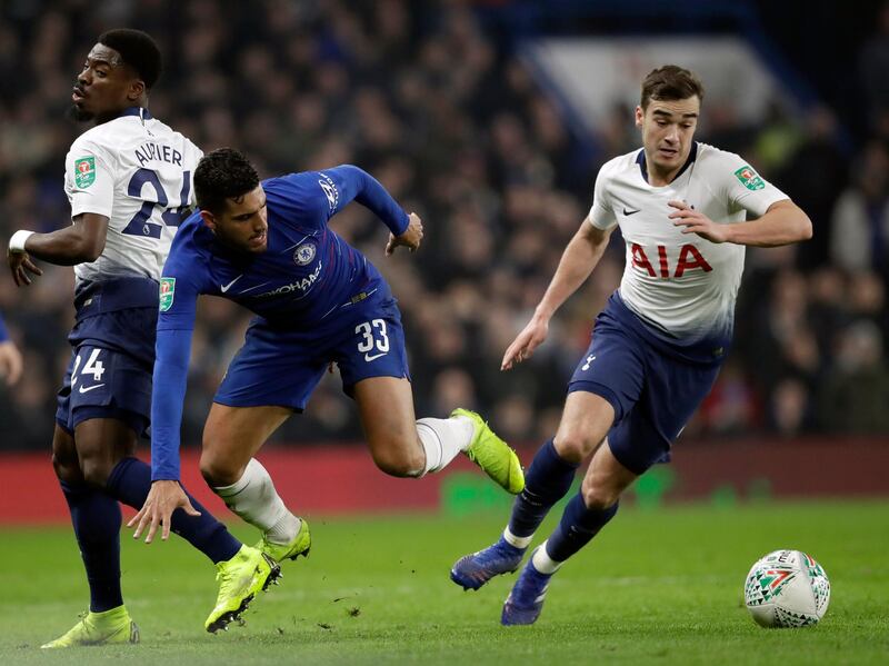 Chelsea's Emerson, center, duels for the ball with Tottenham Hotspur's Harry Winks, right, and Serge Aurier during the second leg of the English League Cup semifinal soccer match between Chelsea and Tottenham Hotspur at Stamford Bridge stadium in London, Thursday, Jan. 24, 2019. (AP Photo/Matt Dunham)