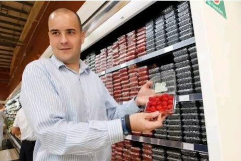 Shaun Swart, fresh produce buyer for Spinneys, oversees berries flown in from as far as the US. Jeffrey E Biteng / The National