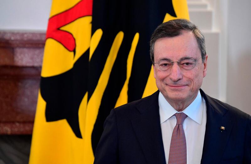 (FILES) In this file photo taken on January 31, 2020 Italian economist Mario Draghi smiles after being awarded the Federal Cross of Merit during a ceremony at the presidential Bellevue Palace in Berlin. Italy's president Sergio Mattarella on February 2, 2021 summoned former ECB chief Mario Draghi to meet him, after talks between the ruling parties failed to agree a new government. Earlier, House Speaker Roberto Fico said that after four days of negotiations, the parties could not find a new majority.  / AFP / Tobias SCHWARZ
