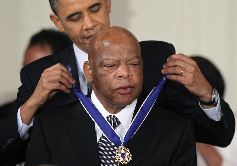 US Representative John Lewis is presented with the 2010 Medal of Freedom by President Barack Obama during an East Room event at the White House on February 15, 2011 in Washington, DC. AFP