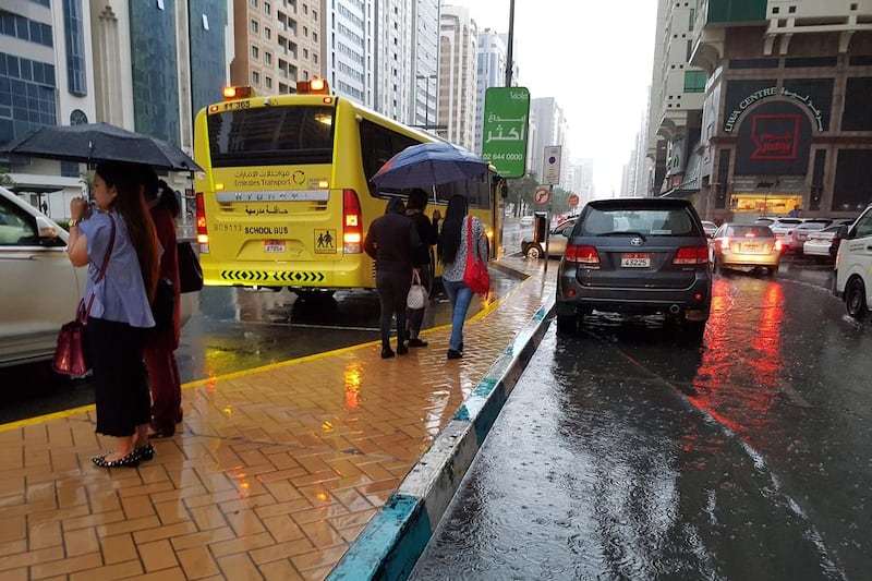 Abu Dhabi residents were greeted by heavy rain as they prepared to go to work. Delores Johnson / The National