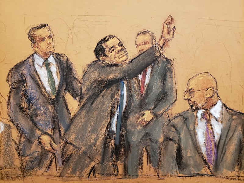 El Chapo waving to his wife Emma Coronel Aispuro upon entering the courtroom. Reuters