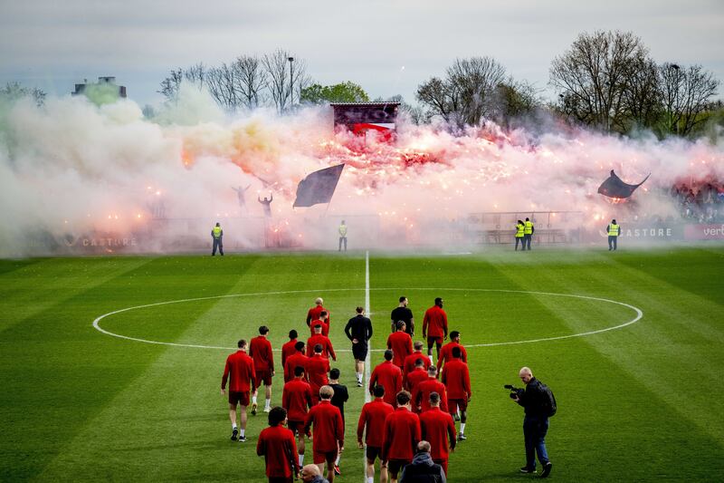 Supporters of Feyenoord light flares during a public training session at the Varkenoord Sports Complex in Rotterdam. EPA